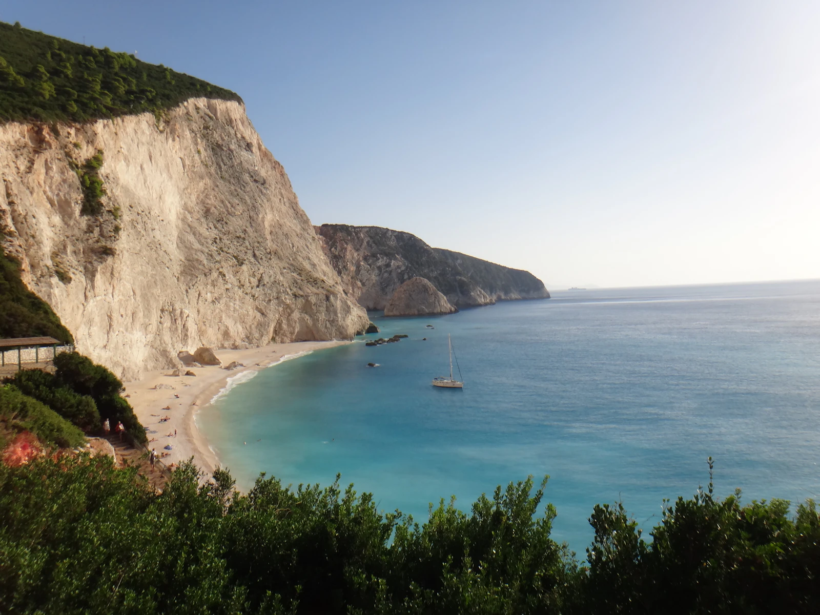 A boat below the white cliffs of the Lefkada west coast