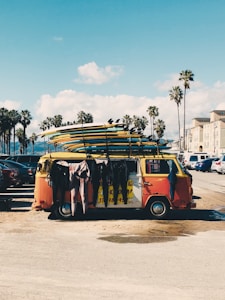 yellow and red bus on road during daytime