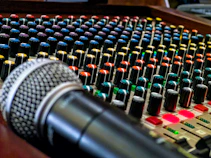 black and silver microphone on audio mixer