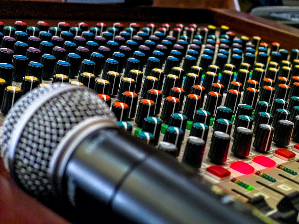 black and silver microphone on audio mixer photo – Free Image on Unsplash
