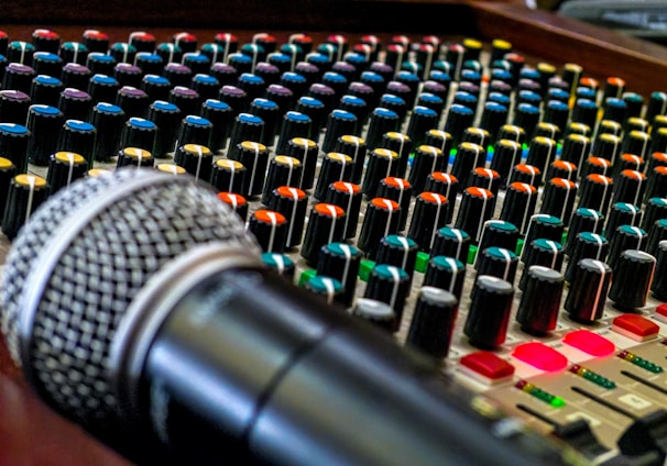 black and silver microphone on audio mixer