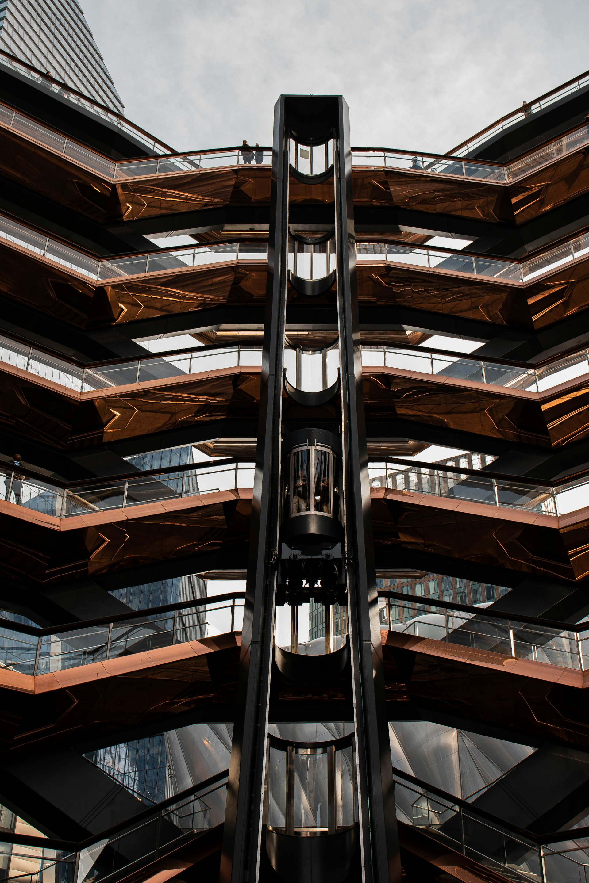 woman wearing yellow long-sleeved dress under white clouds and blue sky during daytime