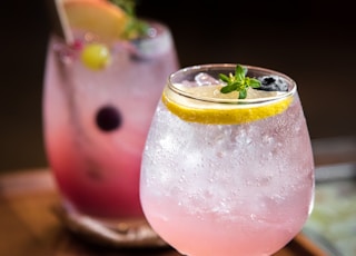 clear wine glass with pink liquid