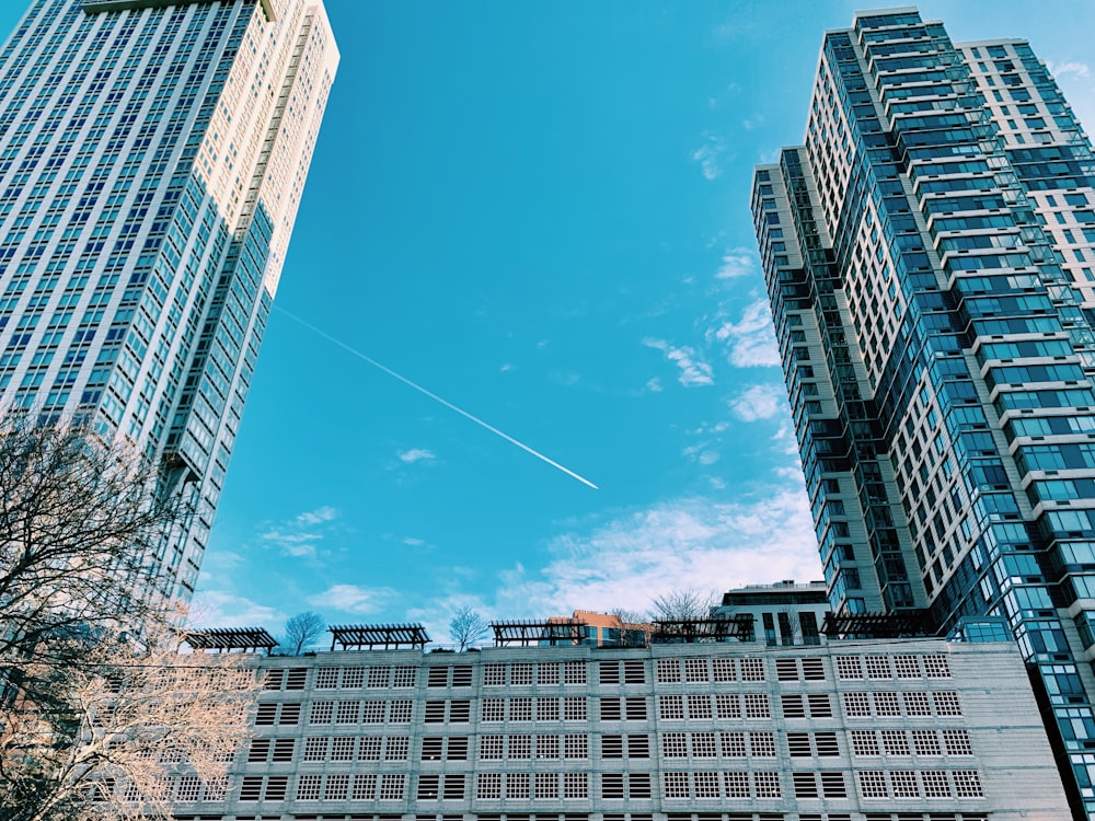 white clouds over city buildings during daytime