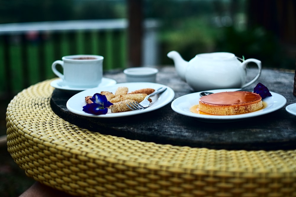 white ceramic teapot on white ceramic plate