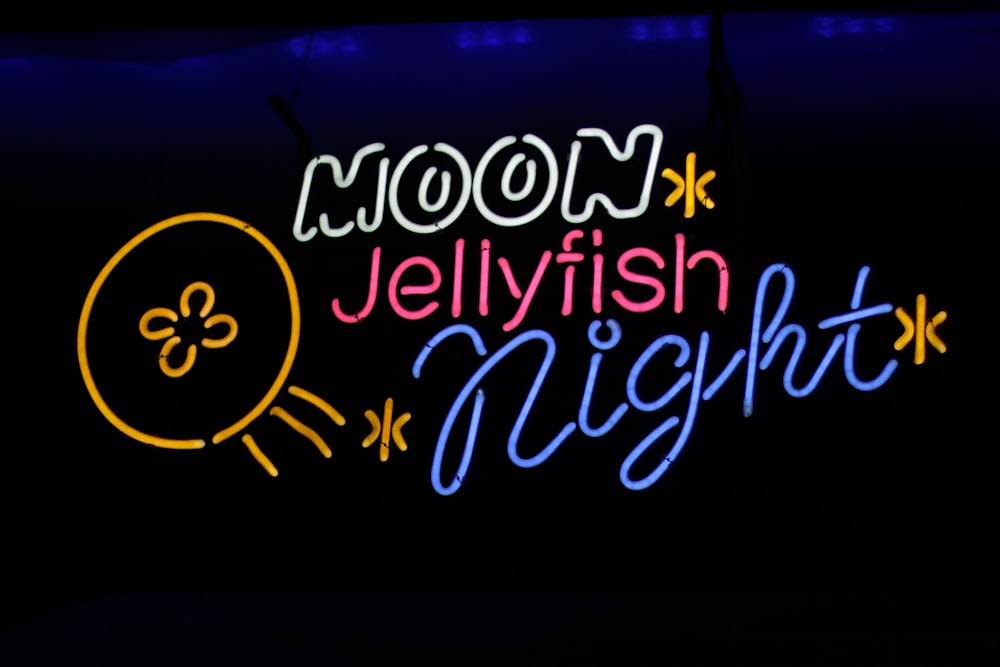 a neon sign that says moon jellyfish night