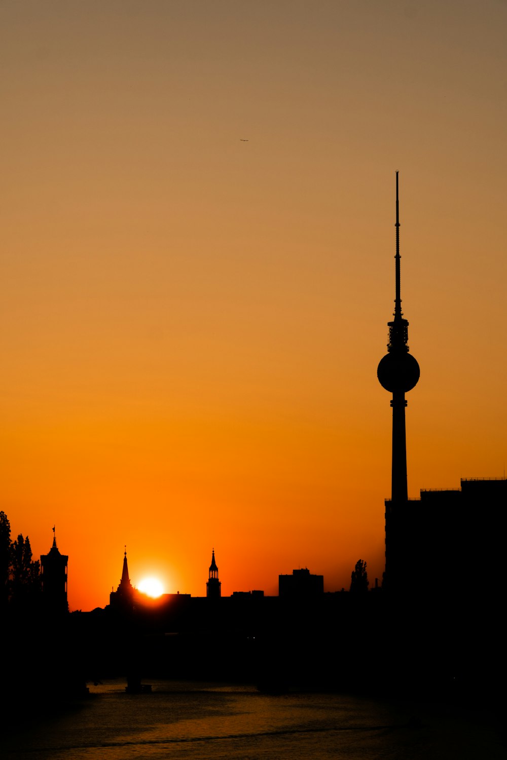 silhouette of city buildings during sunset