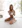 woman in white brassiere and panty sitting on bed