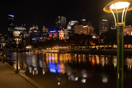 city skyline during night time in Flinders Street Australia