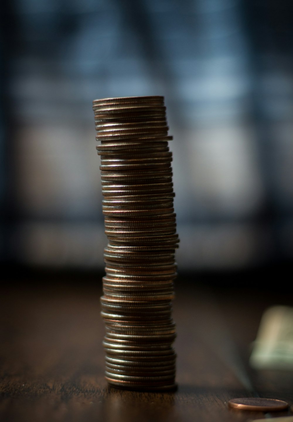 gold round coins on brown wooden table