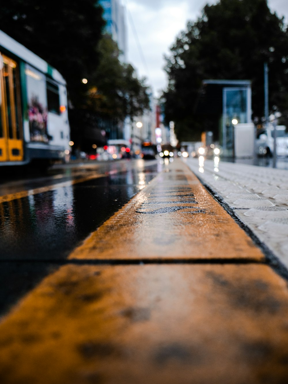 yellow and black train on rail during daytime