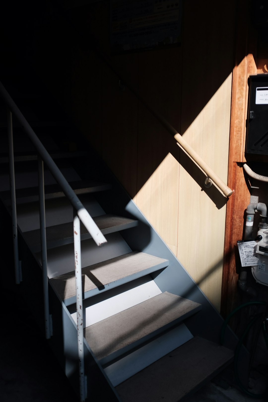 white staircase with brown wooden railings