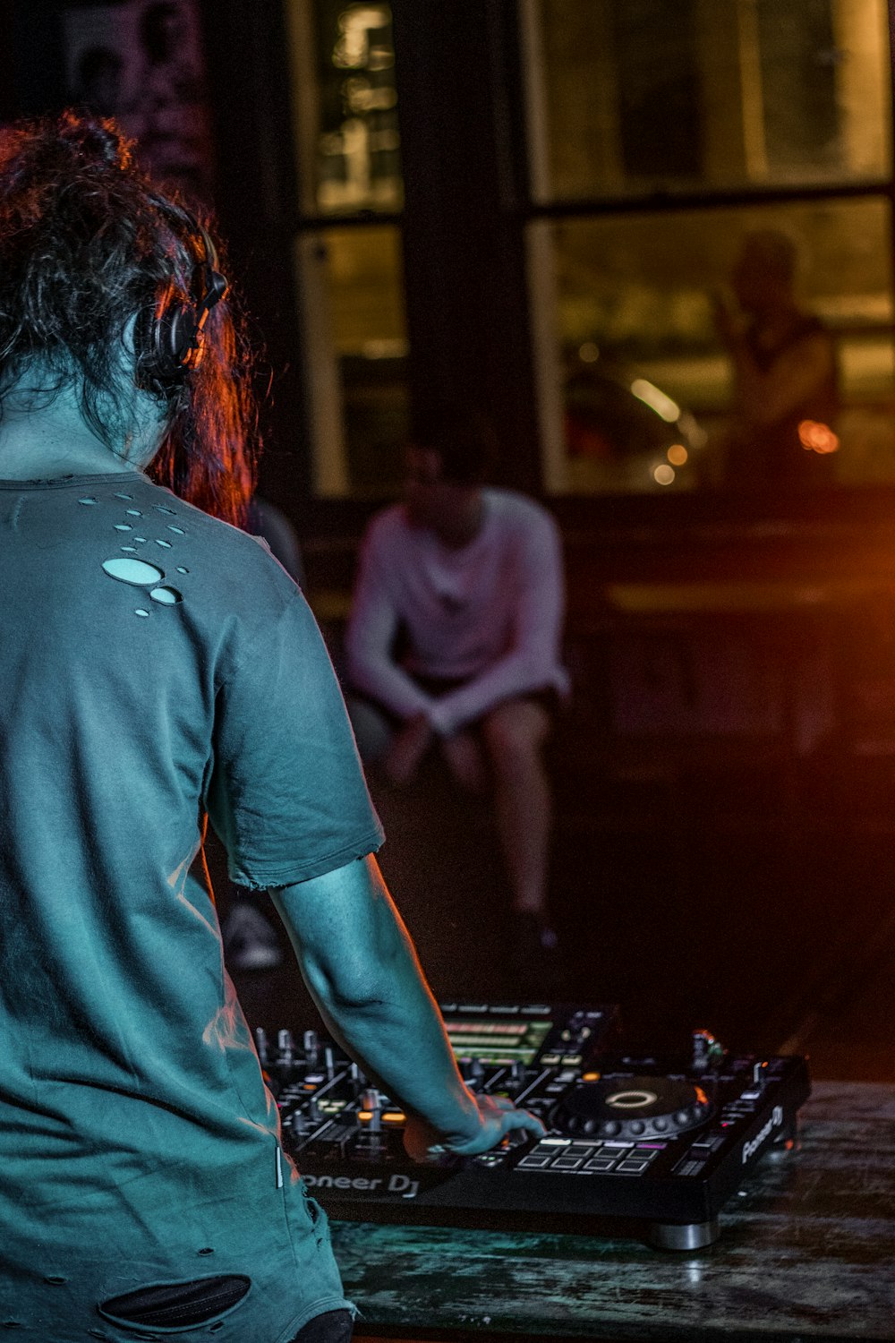 woman in blue t-shirt playing chess