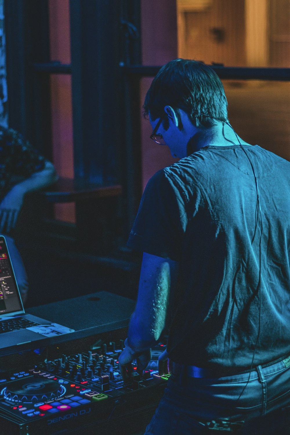 man in blue dress shirt using laptop computer