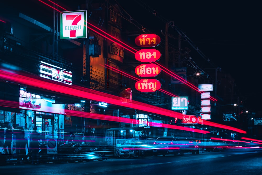 red and white kanji text building during night time