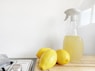 yellow lemon fruit beside clear glass bottle