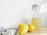 yellow lemon fruit beside clear glass bottle
