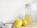 yellow lemon fruit beside clear glass bottle