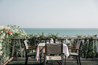 white table and chairs on a sunny day