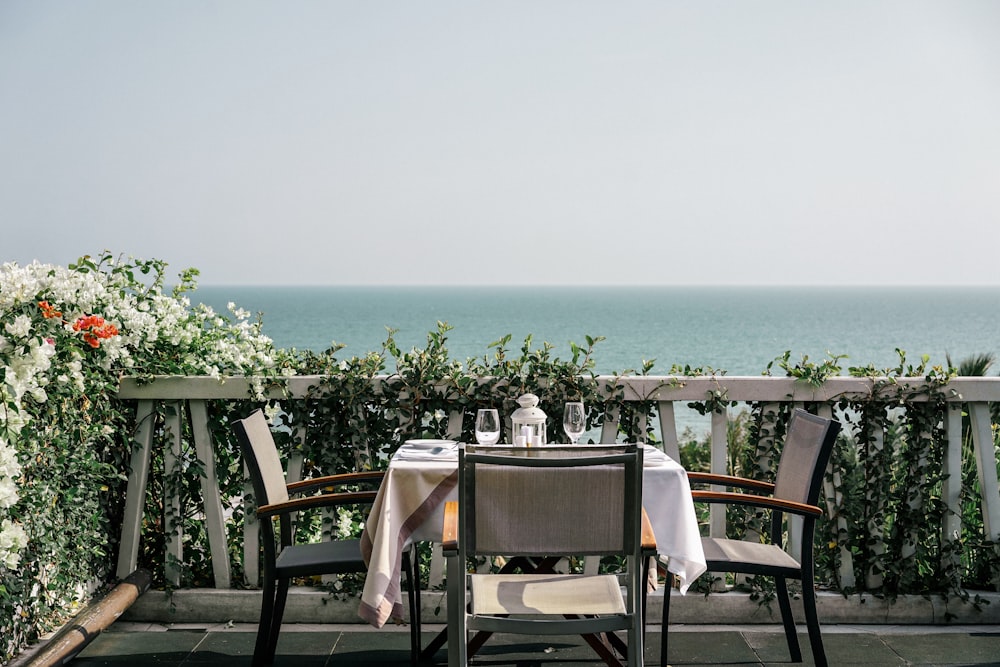 white table and chairs on a sunny day