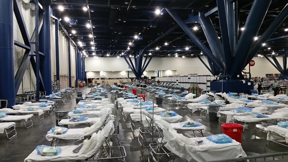 white and blue tables and chairs inside building