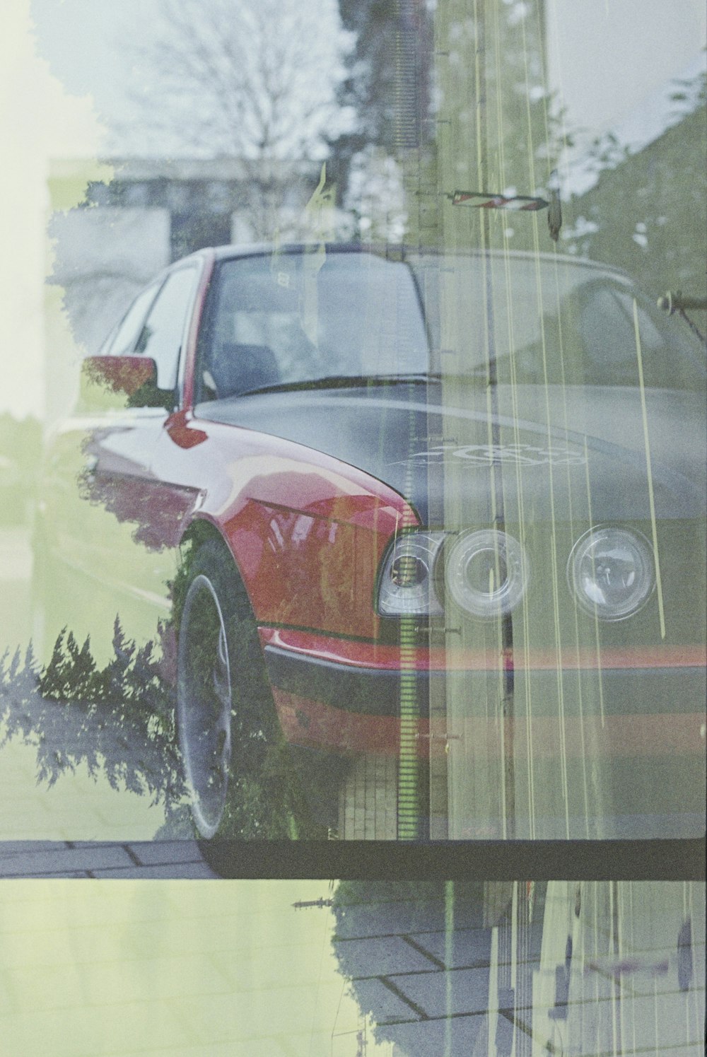 red car on road during daytime