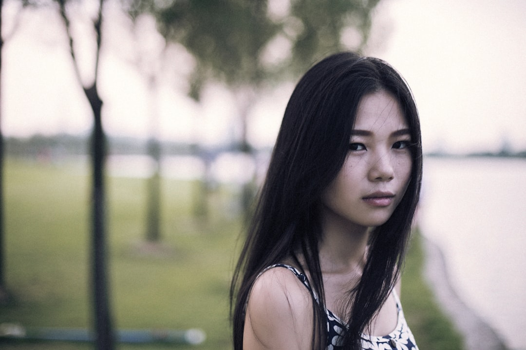 woman in white and black floral tank top