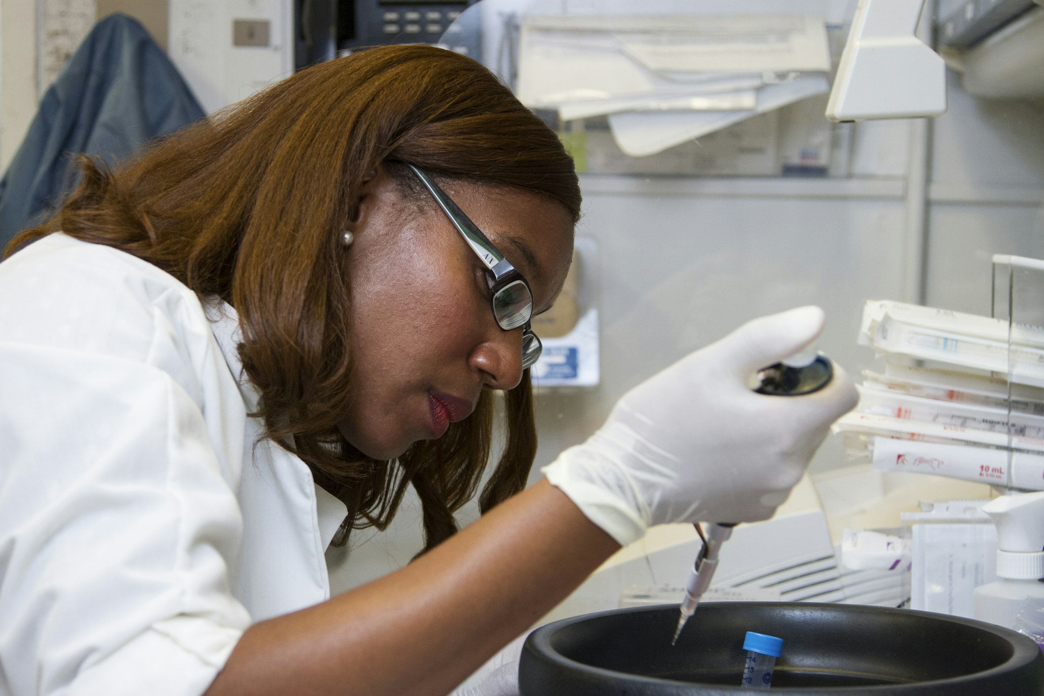 A physician pipetting DNA samples into a tube for PCR (National Cancer Institute via Unsplash)