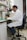 man in white dress shirt sitting on blue office rolling chair