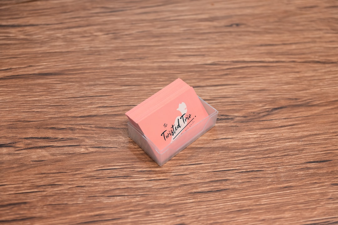 pink and white box on brown wooden table