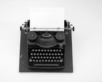 black and white typewriter on white table