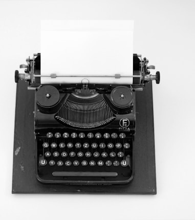 black and white typewriter on white table