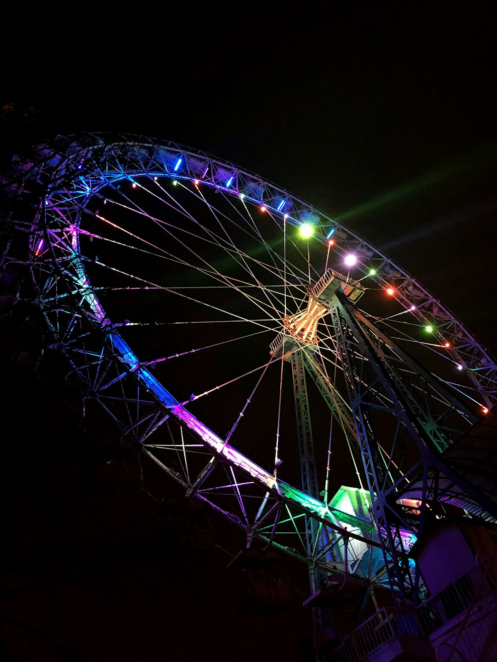 purple and white ferris wheel during night time