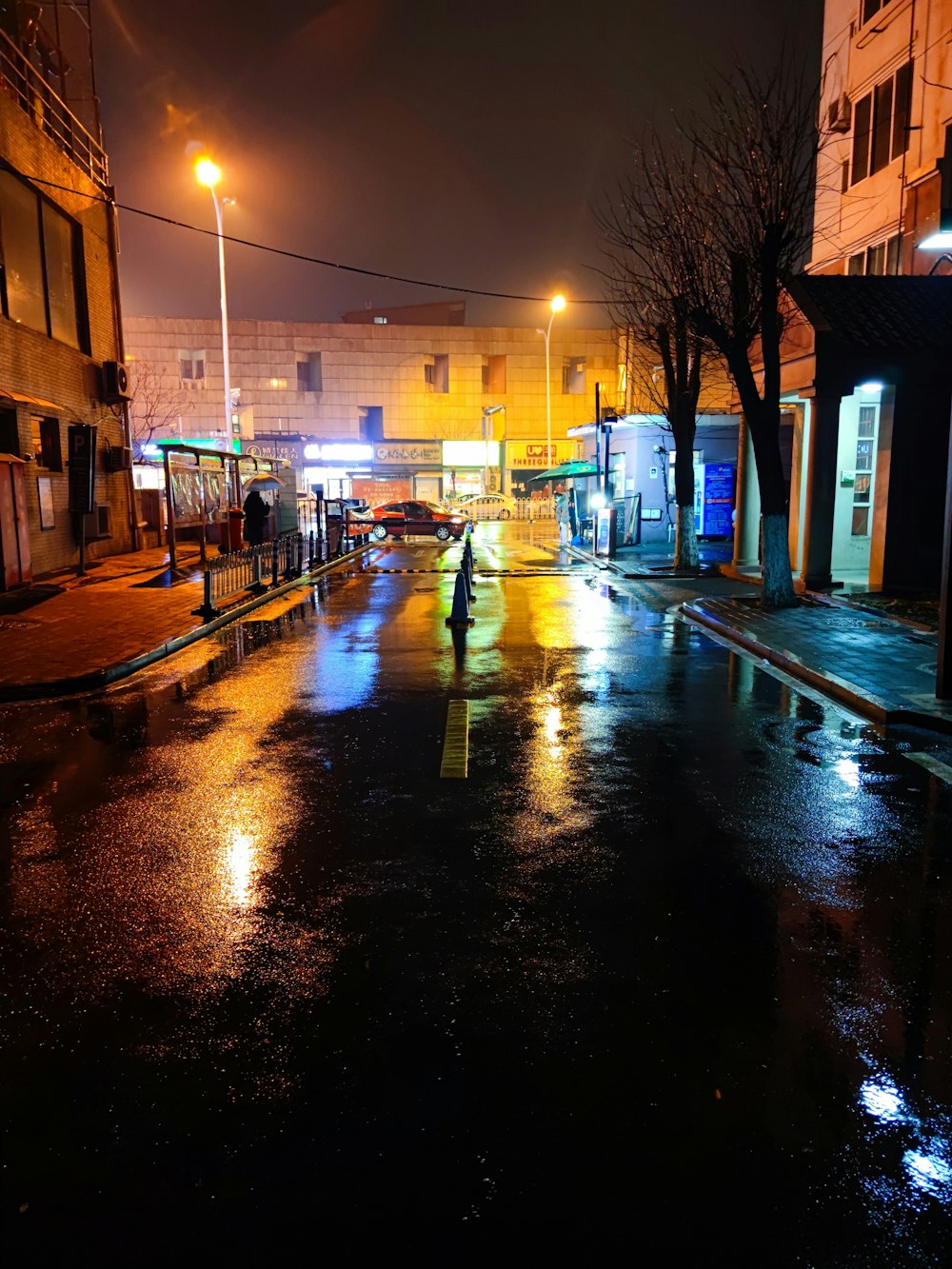 black car on road during night time