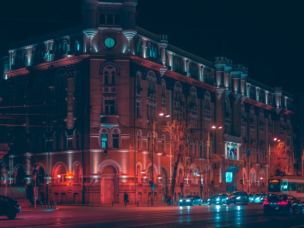 cars on road near building during night time