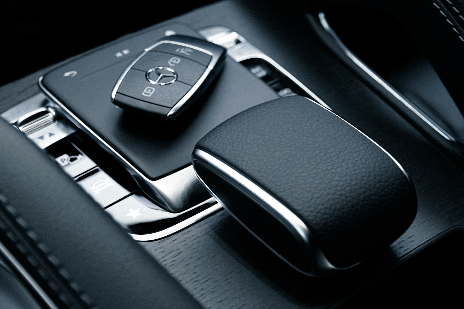 black and silver mercedes benz steering wheel