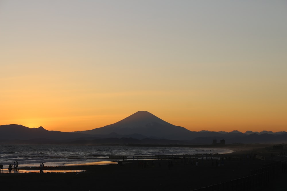 silhouette of mountain during sunset