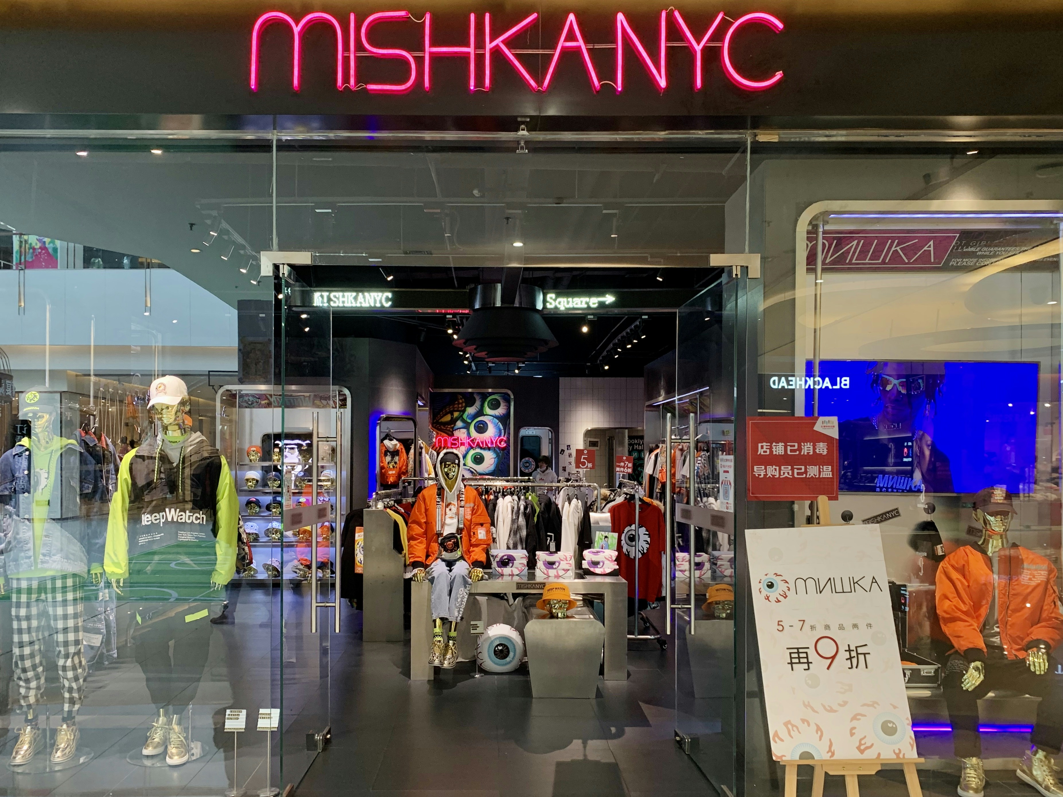 people in a building with a glass wall