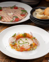Close-up of a beautifully plated Scandinavian dish with fresh ingredients and vibrant colors.