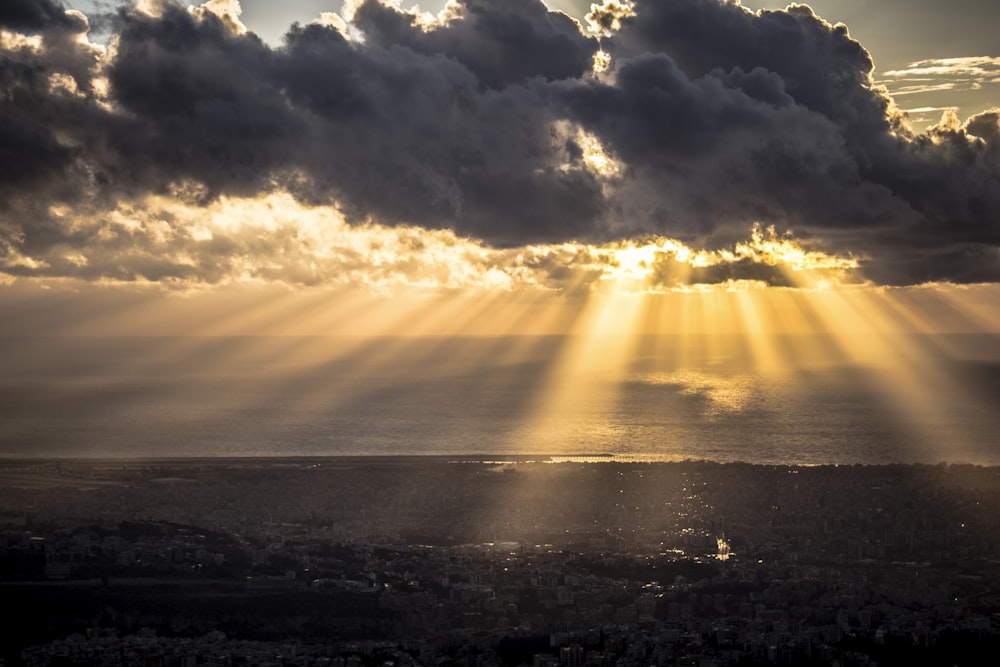 body of water under cloudy sky during sunset