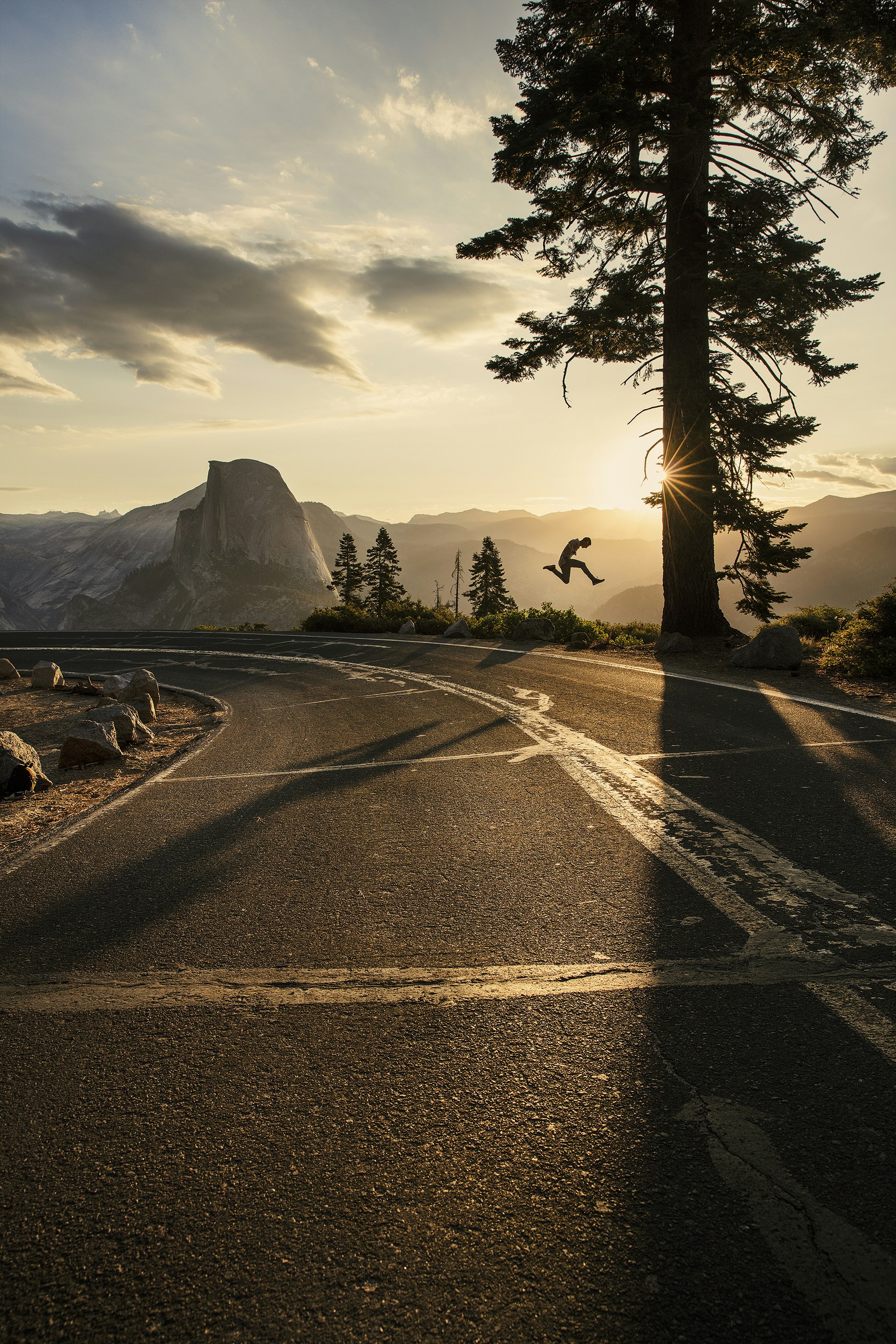gray asphalt road near mountain during daytime