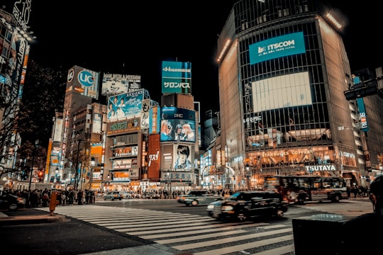 cars on road in city during night time in Hachikō-mae Square Japan