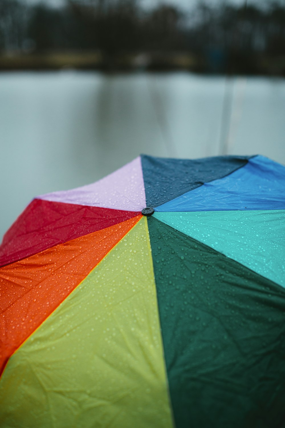 red yellow green umbrella on water