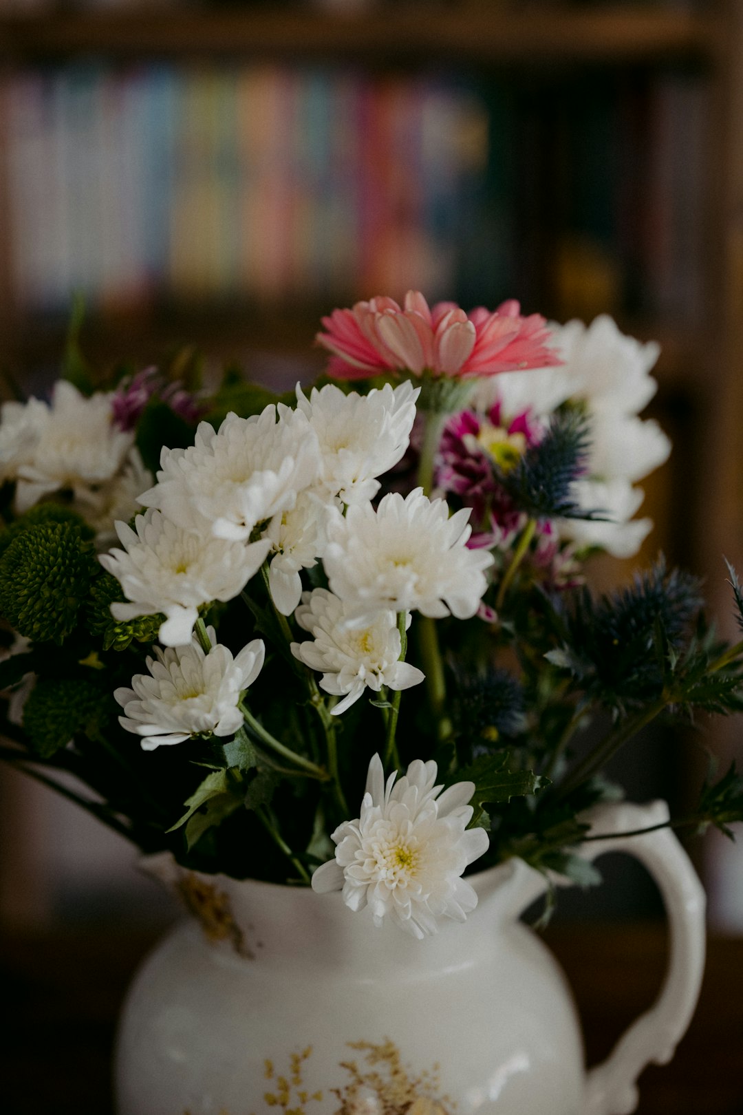 white flowers in brown ceramic vase