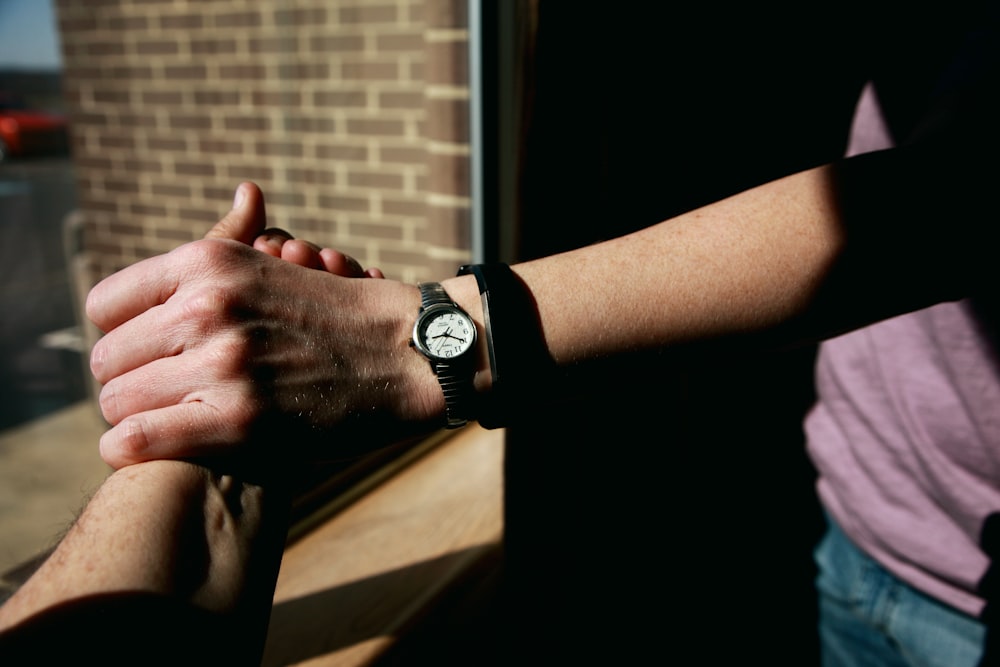 person wearing black apple watch