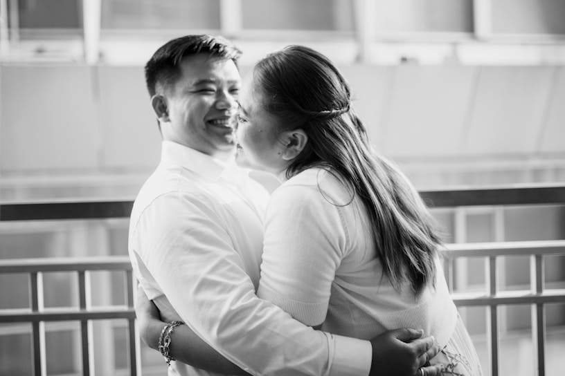 A warm, candid photo of a happy couple meeting for the first time at a cozy café, capturing genuine smiles.