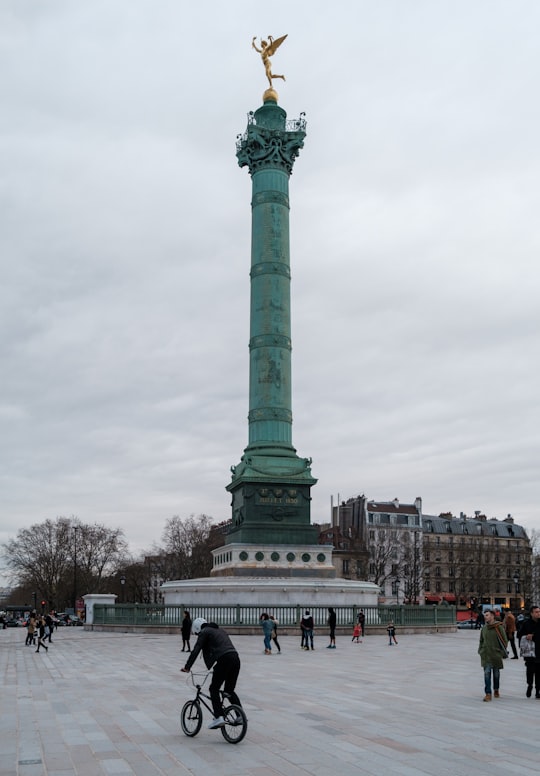 green concrete statue under cloudy sky during daytime in July Column France