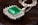 silver and green gemstone studded necklace