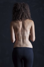 topless woman in black skirt