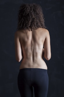 topless woman in black skirt